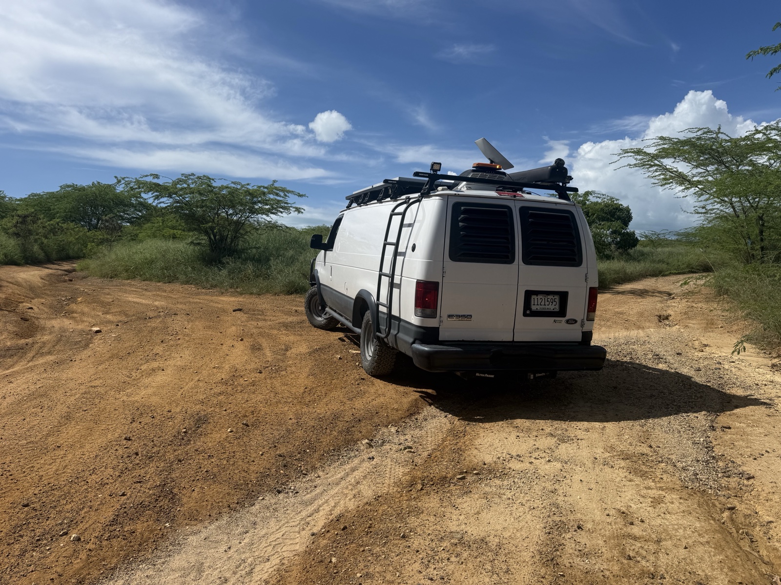 Production van on a dirt road